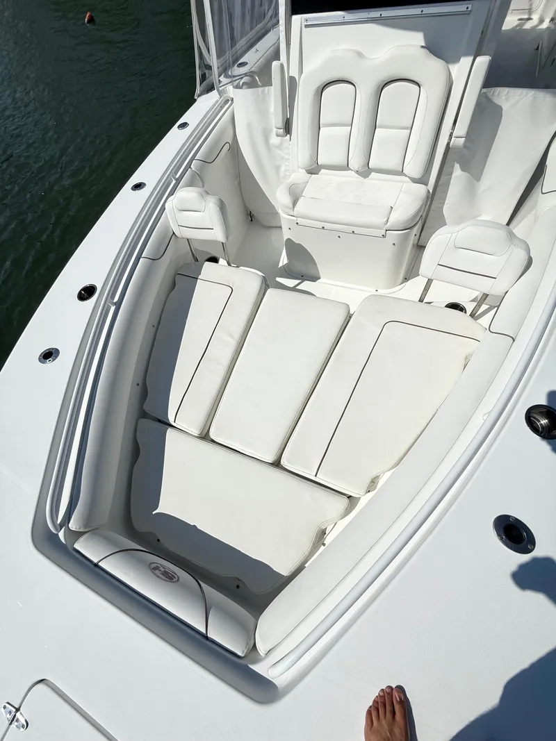 Slide: The Image of 2018 Sea Hunt Gamefish 30 Forward Seating, white cushioned boat interior. - 12