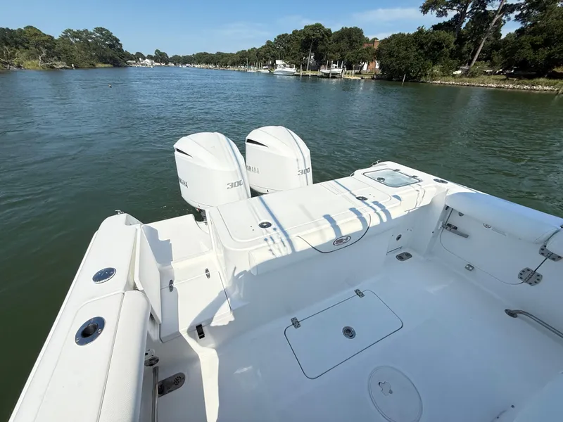 Slide: The Image of 2018 Sea Hunt Gamefish 30 boat with twin Yamaha 300 engines on a calm river. - 13