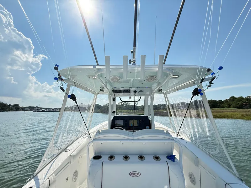 Slide: The Image of 2018 Sea Hunt Gamefish 30 boat with forward seating on a sunny day. - 18