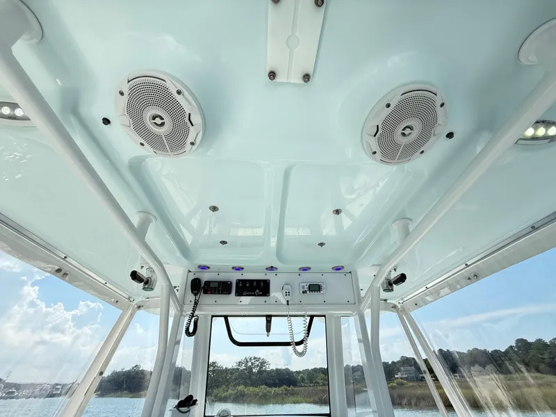 Slide: The Image of Interior view of 2018 Sea Hunt Gamefish 30 boat with speakers and control panel. - 20