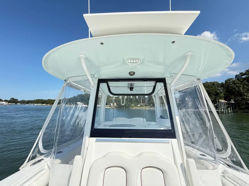 Slide: The Image of 2018 Sea Hunt Gamefish 30 boat with forward seating on a sunny day. - 22