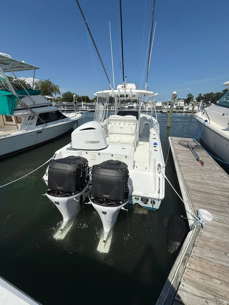Slide: The Image of 2018 Sea Hunt Gamefish 30 with Yamaha engines docked at marina. - 25