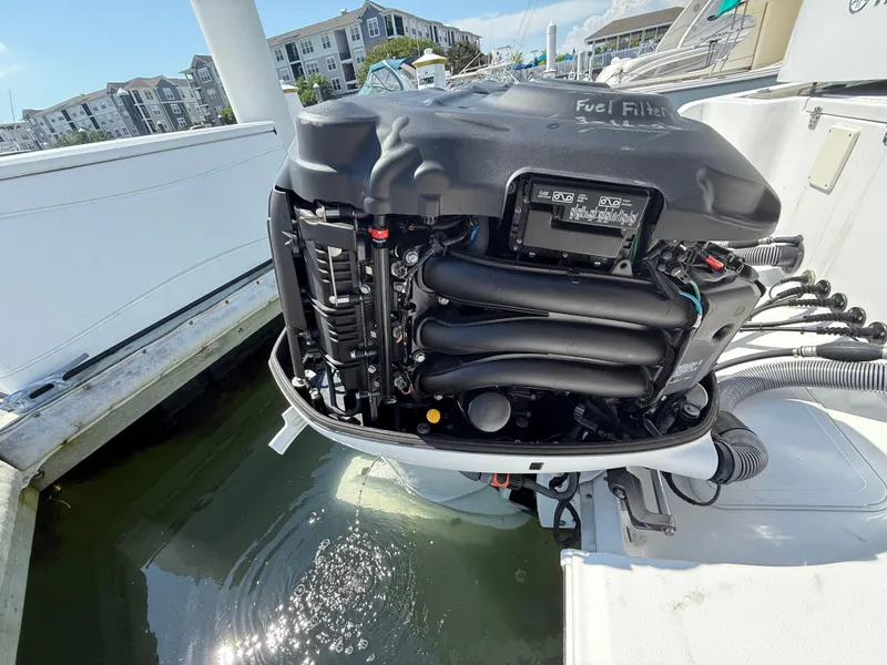 Slide: The Image of 2018 Sea Hunt Gamefish 30 engine, open cover, docked in marina. - 26