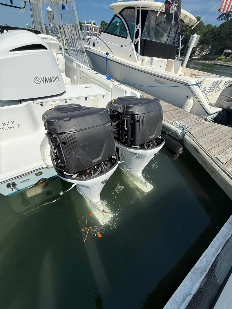 Slide: The Image of 2018 Sea Hunt Gamefish 30 with Yamaha outboard motors docked at marina. - 28