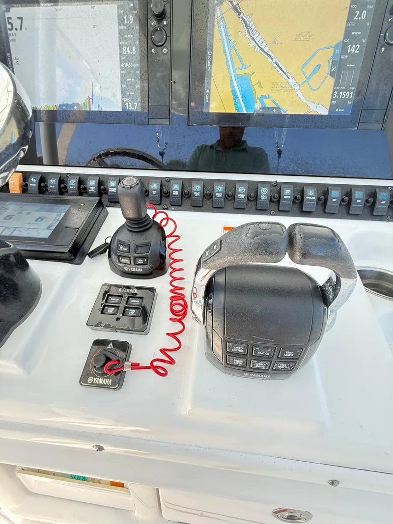 Slide: The Image of Control panel of 2018 Sea Hunt Gamefish 30 with navigation screens and Yamaha controls. - 7