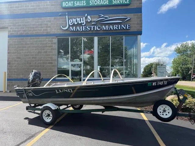 The Image of 1999 Lund SSV-16 Tiller boat on trailer at Jerry's Majestic Marine dealership. - 0