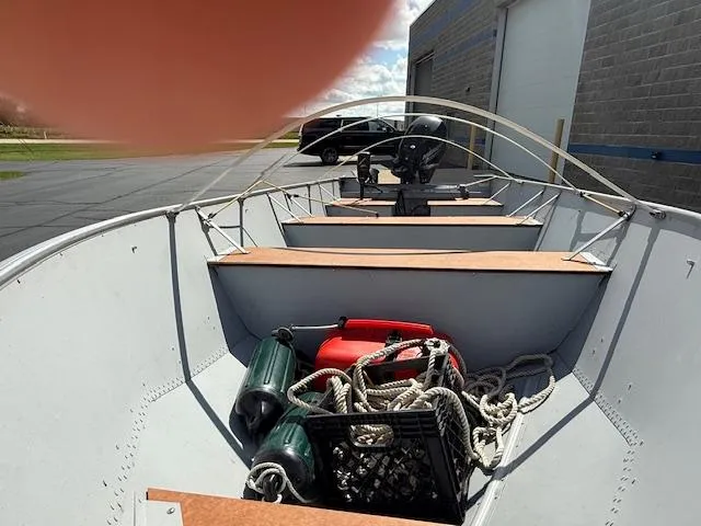 Slide: The Image of 1999 Lund SSV-16 Tiller boat interior with ropes, fuel tank, and accessories. - 5