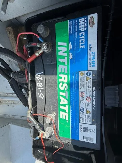 Slide: The Image of Interstate deep cycle battery in a 1999 Lund SSV-16 Tiller boat. - 9