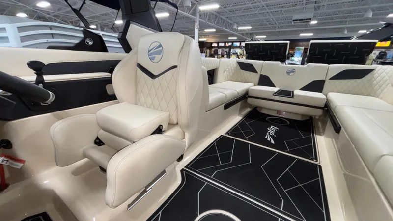 Slide: The Image of Luxurious interior of 2025 Tigé Z5 boat with plush seating and modern design. - 11