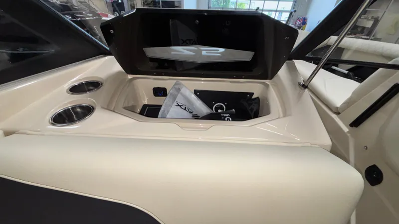 Slide: The Image of 2025 Tigé Z5 boat interior with storage compartment and cup holders. - 14