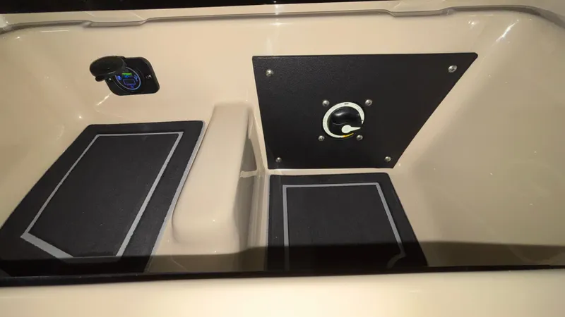 Slide: The Image of 2025 Tigé Z5 boat interior with control panel and storage compartment. - 16