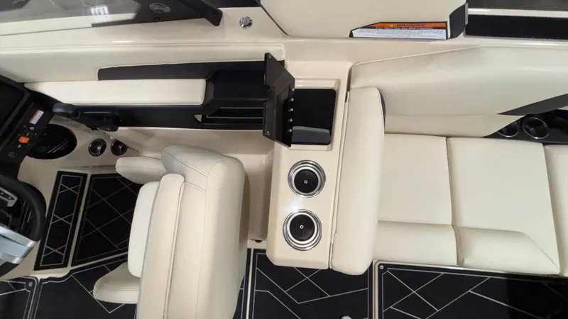 Slide: The Image of 2025 Tigé Z5 boat interior with beige seating and modern dashboard design. - 21