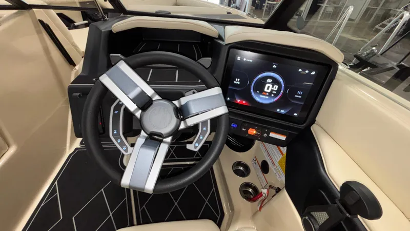 Slide: The Image of 2025 Tigé Z5 boat dashboard with modern steering wheel and digital display. - 23