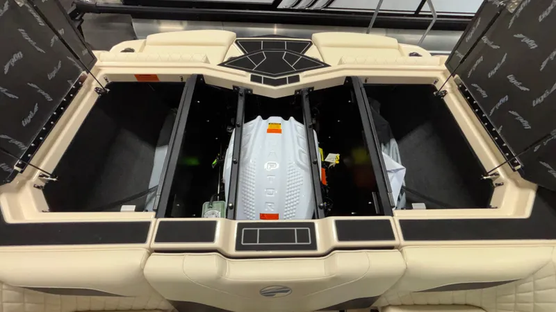 Slide: The Image of 2025 Tigé Z5 boat engine compartment with open hatches, showcasing modern design. - 33