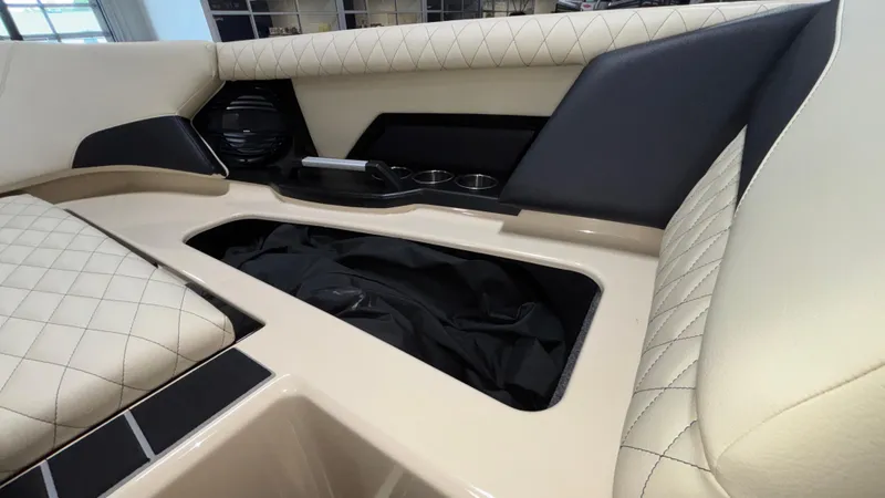 Slide: The Image of 2025 Tigé Z5 boat interior with quilted seats and storage compartment. - 38