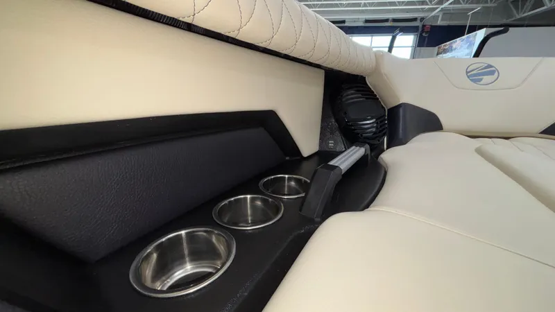 Slide: The Image of Interior of 2025 Tigé Z5 boat featuring cup holders and luxurious seating. - 39