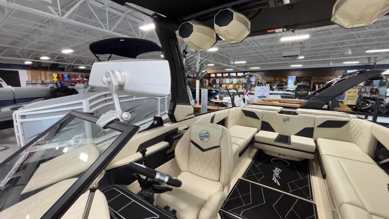 Slide: The Image of 2025 Tigé Z5 boat interior with luxurious seating and modern design in showroom. - 42