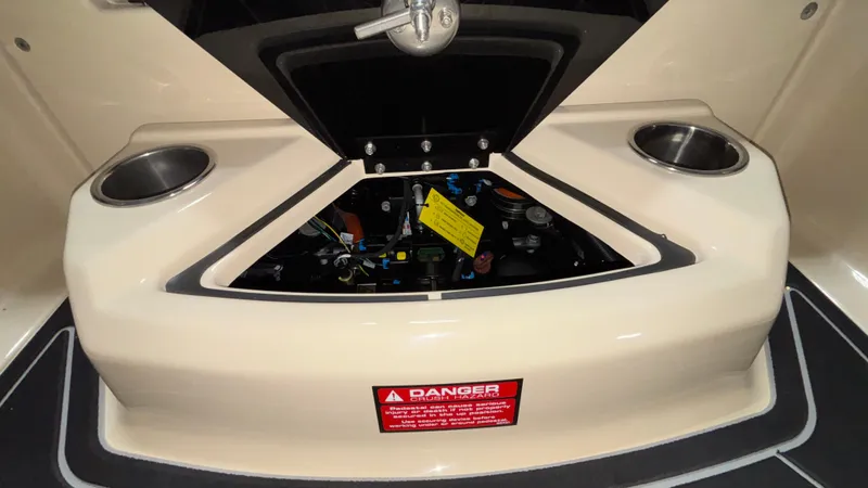 Slide: The Image of 2025 Tigé Z5 boat interior with open storage compartment and cup holders. - 9