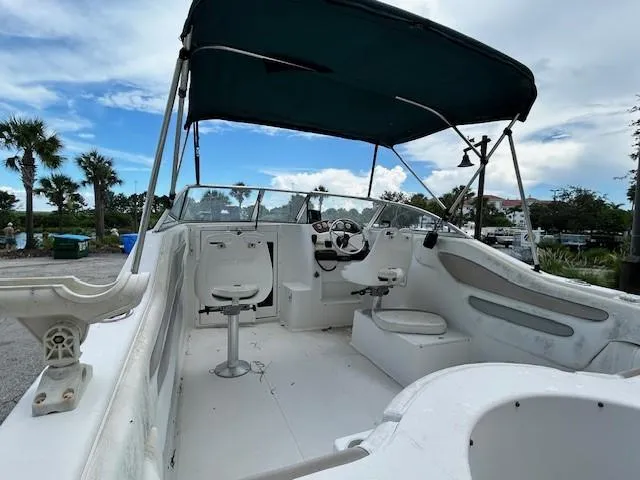 Slide: The Image of 2002 Sea Pro 200 Family Fish boat with canopy, white interior, and steering console. - 6