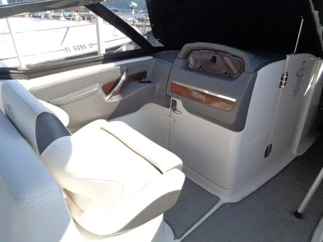 Slide: The Image of Interior of 2015 Chaparral 307 SSX boat with sleek seating and dashboard. - 17