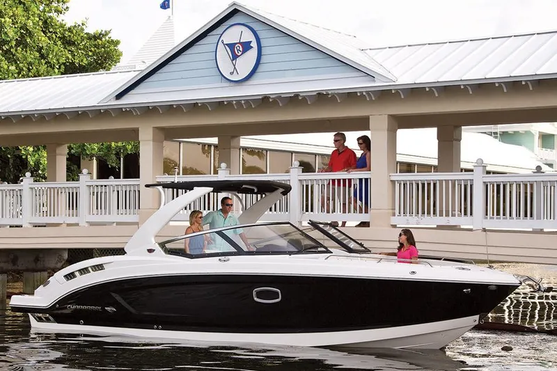Slide: The Image of Manufacturer Provided Image: 2015 Chaparral 307 SSX boat docked near a marina with people onboard. - 43