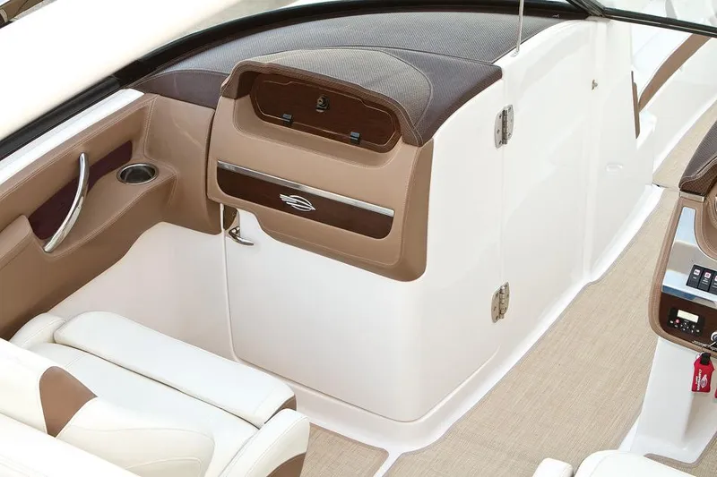 Slide: The Image of Manufacturer Provided Image: 2015 Chaparral 307 SSX boat interior with beige and white seating. - 49