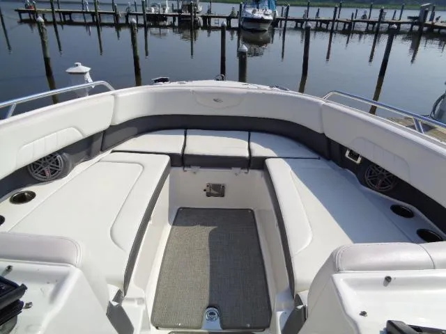 Slide: The Image of 2015 Chaparral 307 SSX boat interior with spacious seating and waterfront view. - 6