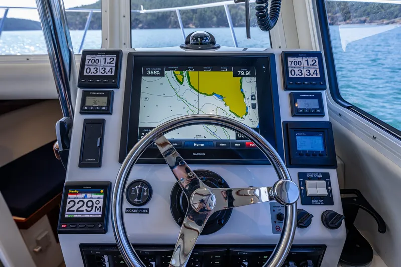 Slide: The Image of Cockpit of 2016 Lindell Ocean Roamer with navigation system and steering wheel. - 15