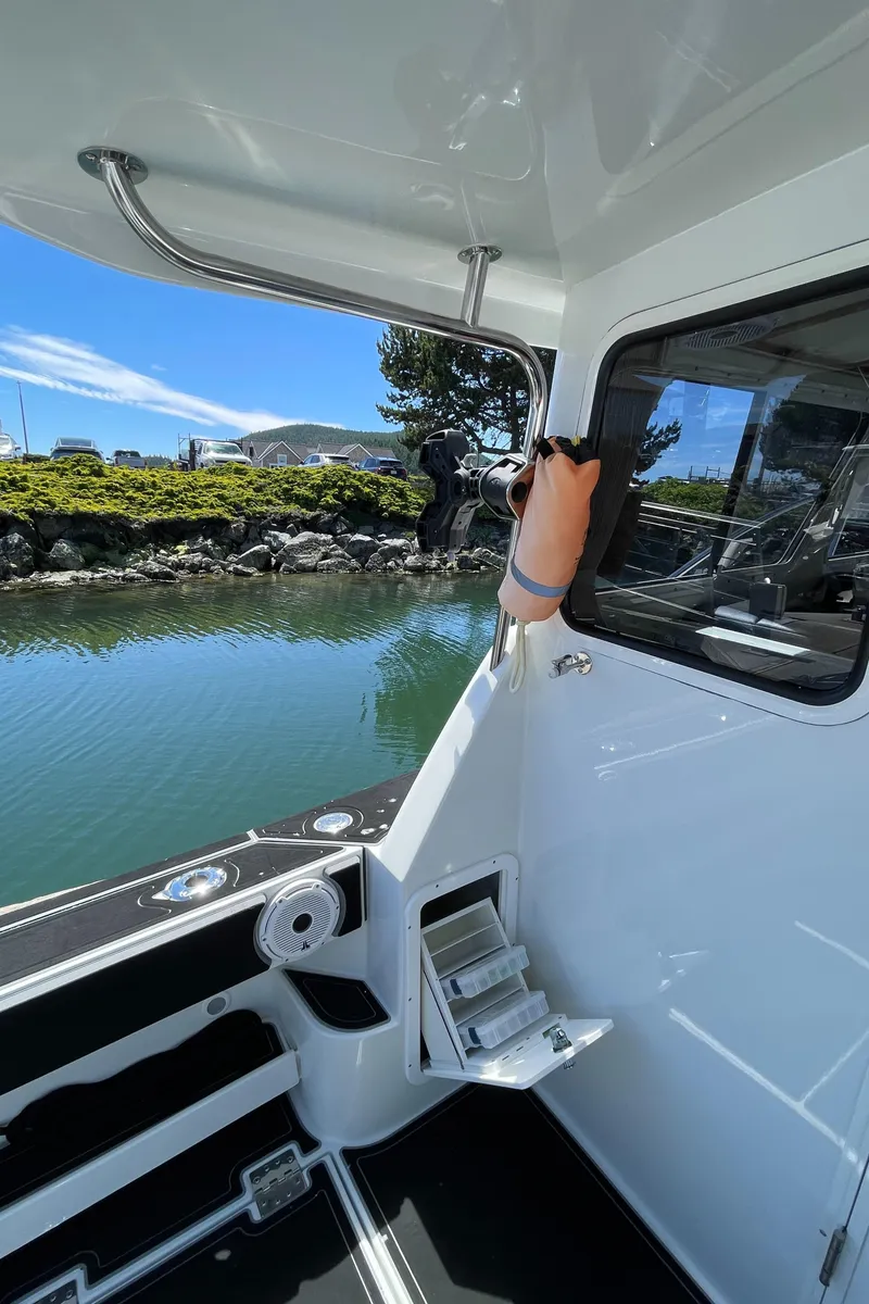 Slide: The Image of 2016 Lindell Ocean Roamer boat interior with water view and dockside setting. - 24
