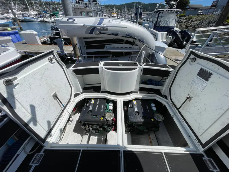 Slide: The Image of Open engine compartment of 2016 Lindell Ocean Roamer boat at marina dock. - 29