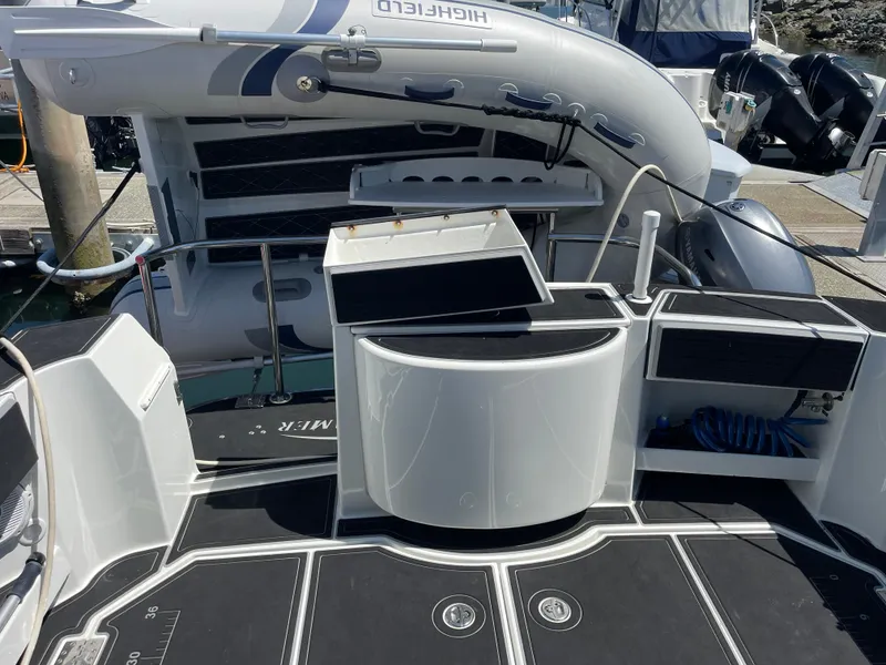 Slide: The Image of 2016 Lindell Ocean Roamer boat deck with inflatable dinghy and storage compartments. - 33