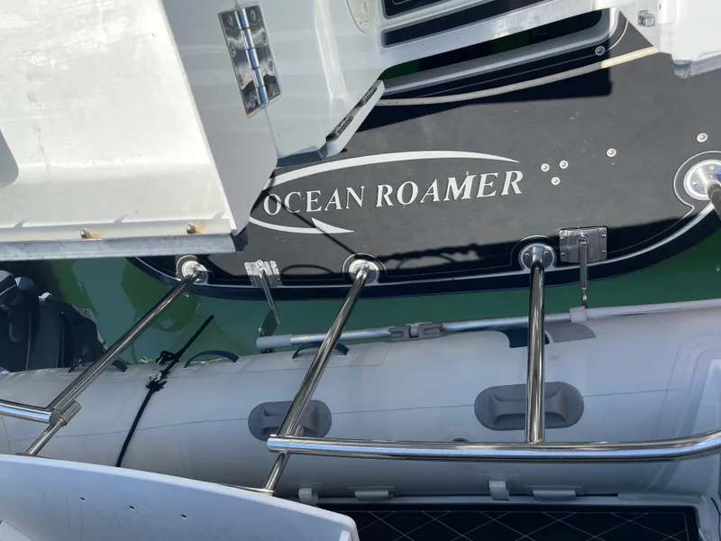 Slide: The Image of Lindell Ocean Roamer 2016 boat with swim platform and ladder in marina. - 35
