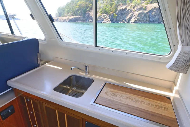 Slide: The Image of Interior of 2016 Lindell Ocean Roamer yacht with sink and scenic ocean view. - 9