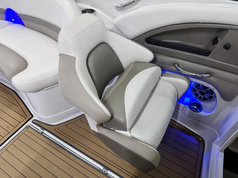Slide: The Image of 2016 Crownline 270 SS boat interior with cushioned seating and blue LED lighting. - 17
