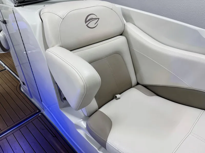 Slide: The Image of 2016 Crownline 270 SS boat seat with elegant white and gray upholstery. - 23