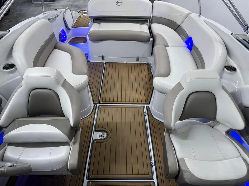 Slide: The Image of Luxurious interior of 2016 Crownline 270 SS boat with plush seating and wood flooring. - 6