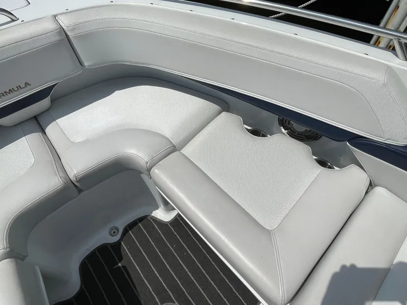 Slide: The Image of 2014 Formula 270 Bowrider interior with gray seating and cup holders. - 11