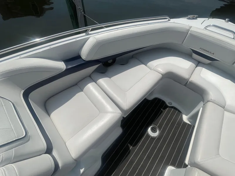 Slide: The Image of 2014 Formula 270 Bowrider interior with white cushioned seating and sleek design. - 12