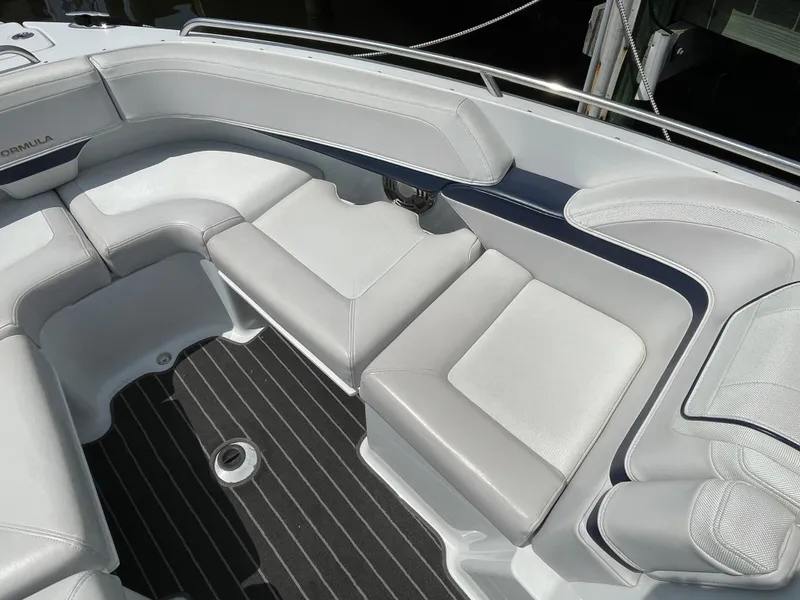 Slide: The Image of 2014 Formula 270 Bowrider interior with white cushioned seating and striped flooring. - 13