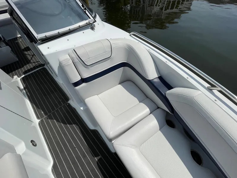 Slide: The Image of 2014 Formula 270 Bowrider boat interior with white seating and striped flooring. - 14