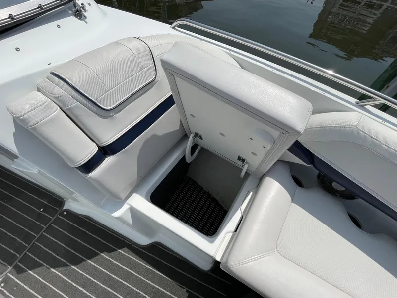Slide: The Image of 2014 Formula 270 Bowrider boat interior with open storage compartment and cushioned seating. - 16
