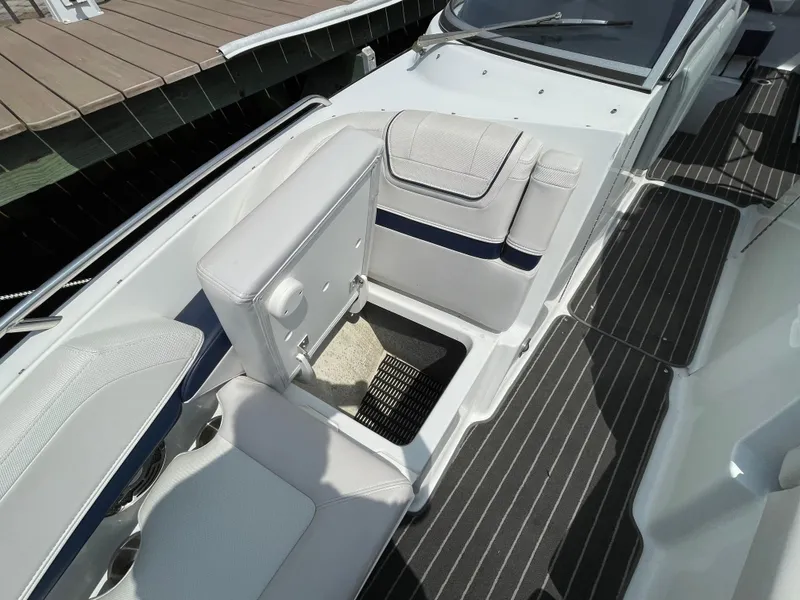 Slide: The Image of 2014 Formula 270 Bowrider interior with white seating and storage compartment. - 17