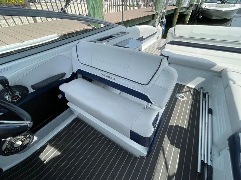 Slide: The Image of 2014 Formula 270 Bowrider interior with white seating and striped flooring. - 20