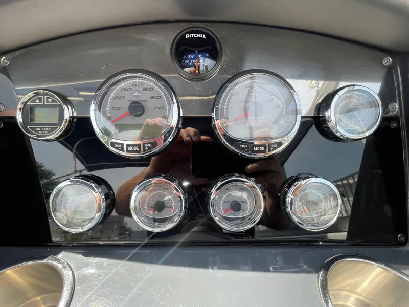 Slide: The Image of Dashboard of a 2014 Formula 270 Bowrider boat with various gauges and controls. - 22