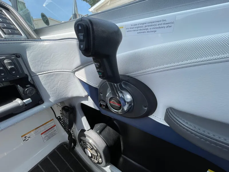 Slide: The Image of 2014 Formula 270 Bowrider boat control panel with throttle and communication equipment. - 28