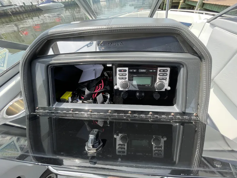 Slide: The Image of 2014 Formula 270 Bowrider dashboard with Clarion stereo system and storage compartment. - 34