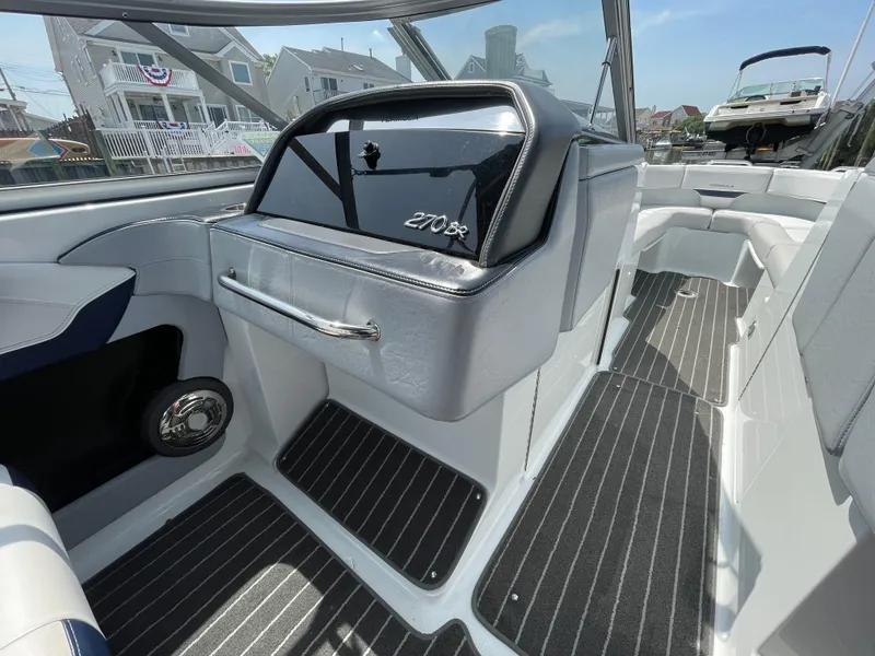 Slide: The Image of Interior of a 2014 Formula 270 Bowrider boat with sleek seating and modern design. - 36