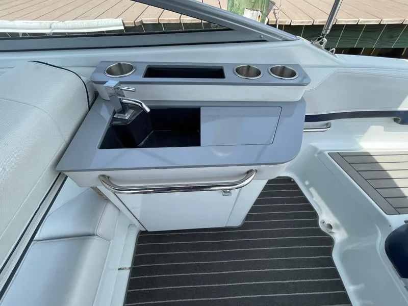 Slide: The Image of 2014 Formula 270 Bowrider boat interior with sink and cup holders. - 40