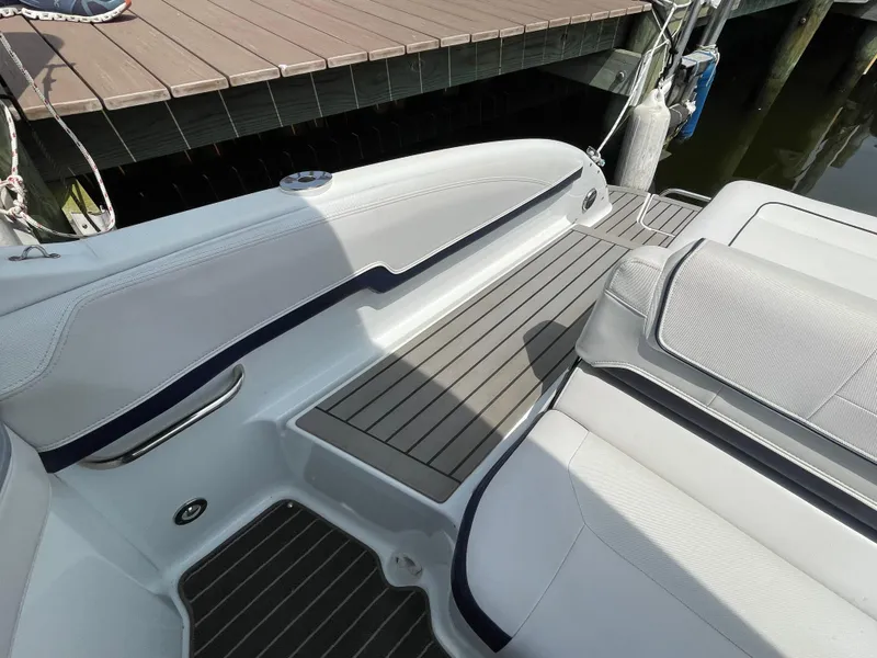Slide: The Image of 2014 Formula 270 Bowrider boat interior with sleek seating and deck design. - 42