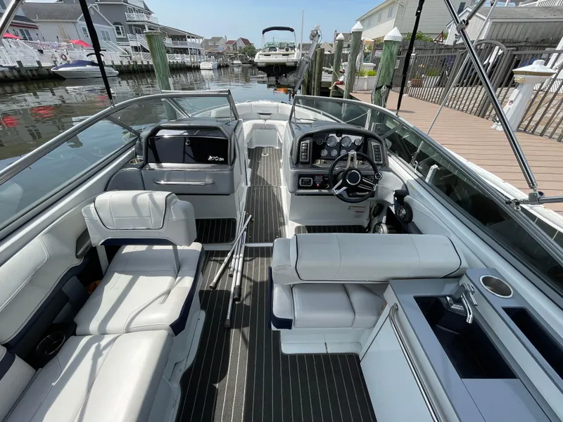 Slide: The Image of 2014 Formula 270 Bowrider boat interior with sleek seating and modern dashboard. - 47